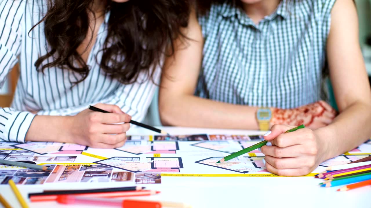 Team marking up a drawing set