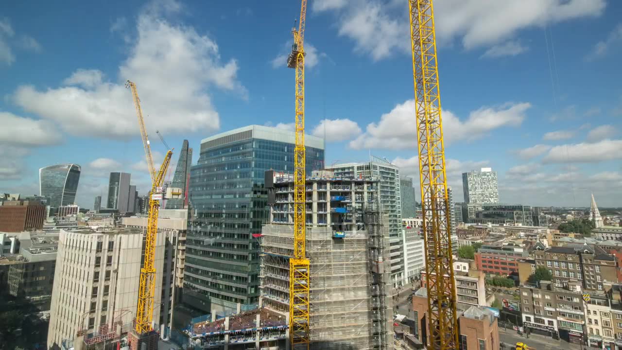 Commercial towers under construction with tower cranes